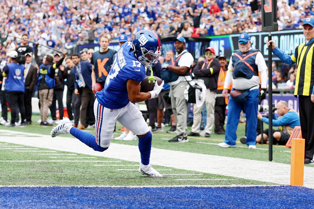 Wan'DEAST RUTHERFORD, NEW JERSEY - OCTOBER 16: Wan'Dale Robinson #17 of the New York Giants scores a touchdown during the second quarter against the Baltimore Ravens at MetLife Stadium on October 16, 2022 in East Rutherford, New Jersey. (Photo by Elsa/Getty Images)ale Robinson